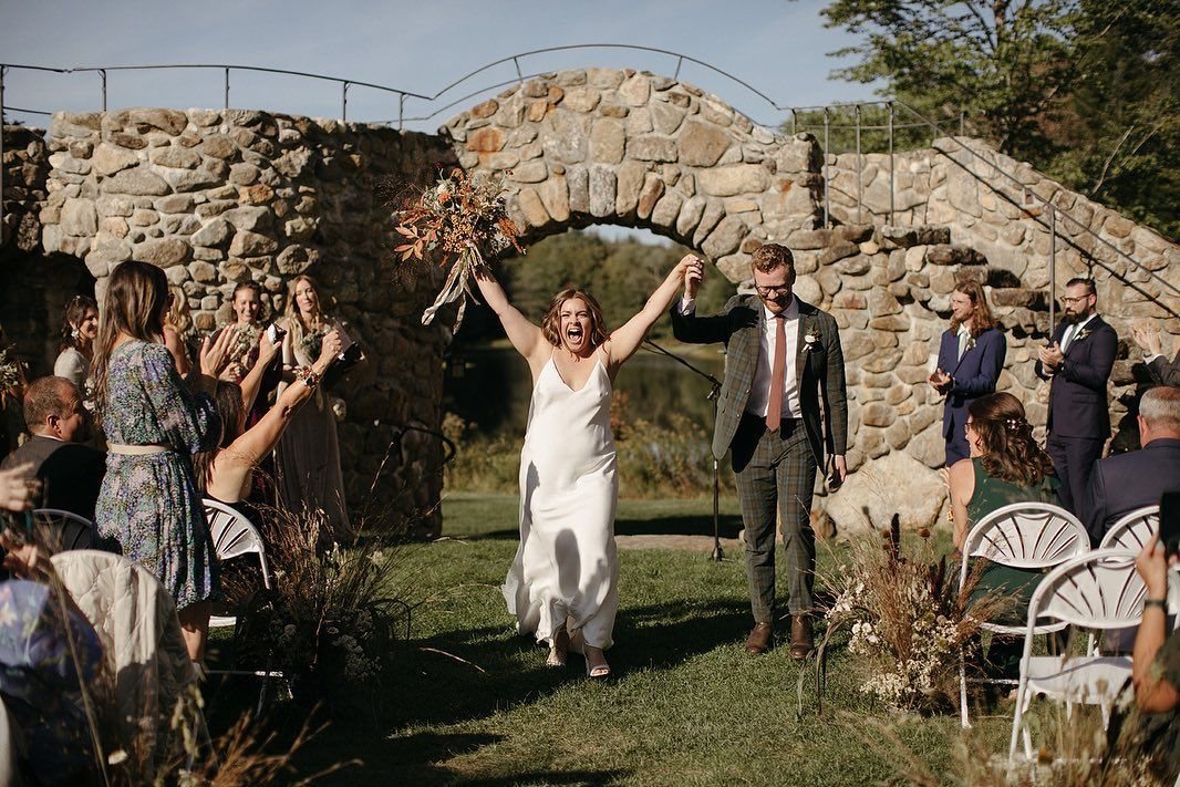 A ceremony in the Walled Garden, the pond beyond the stone wall