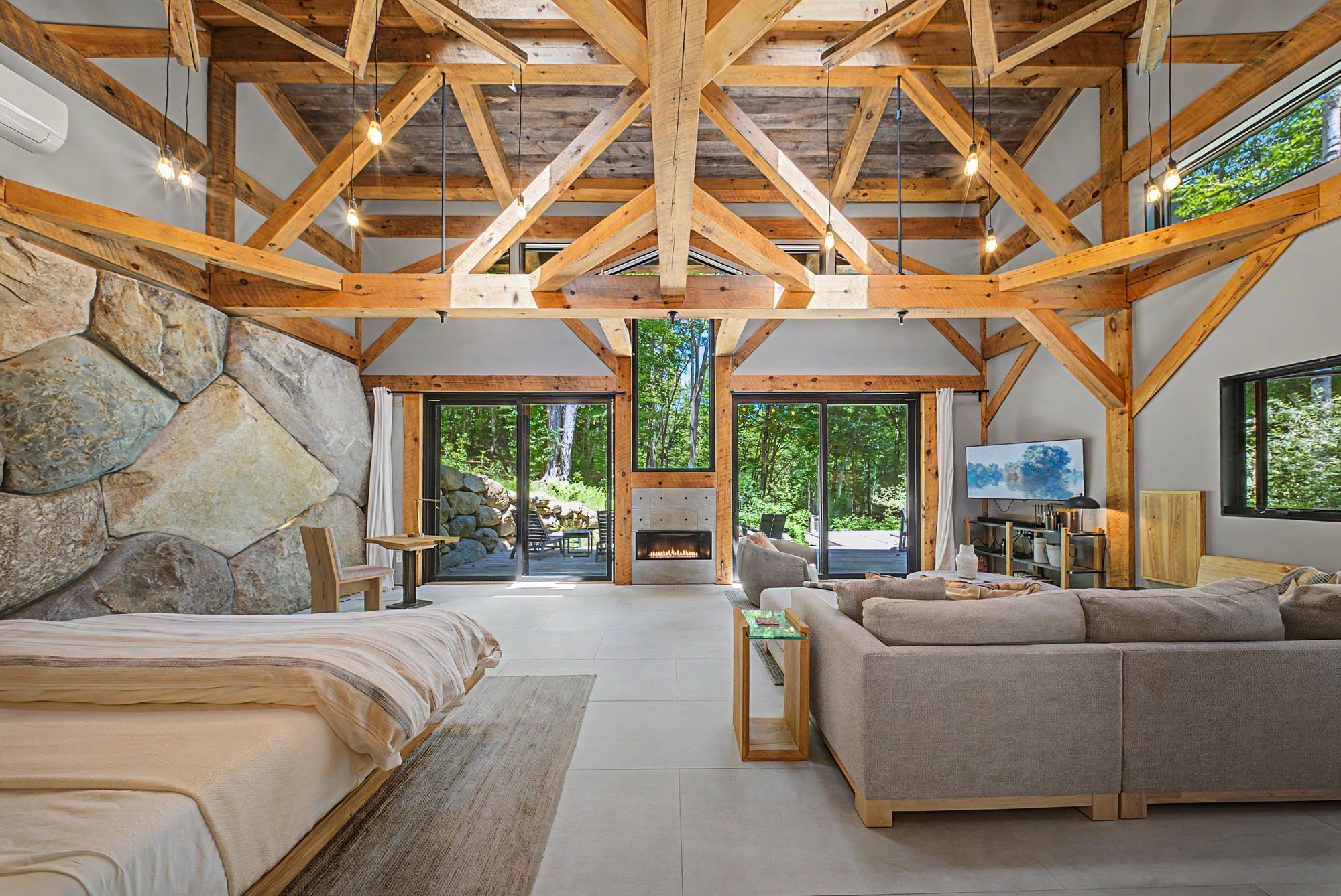 Boulder House, timber framing over a wall of granite boulders