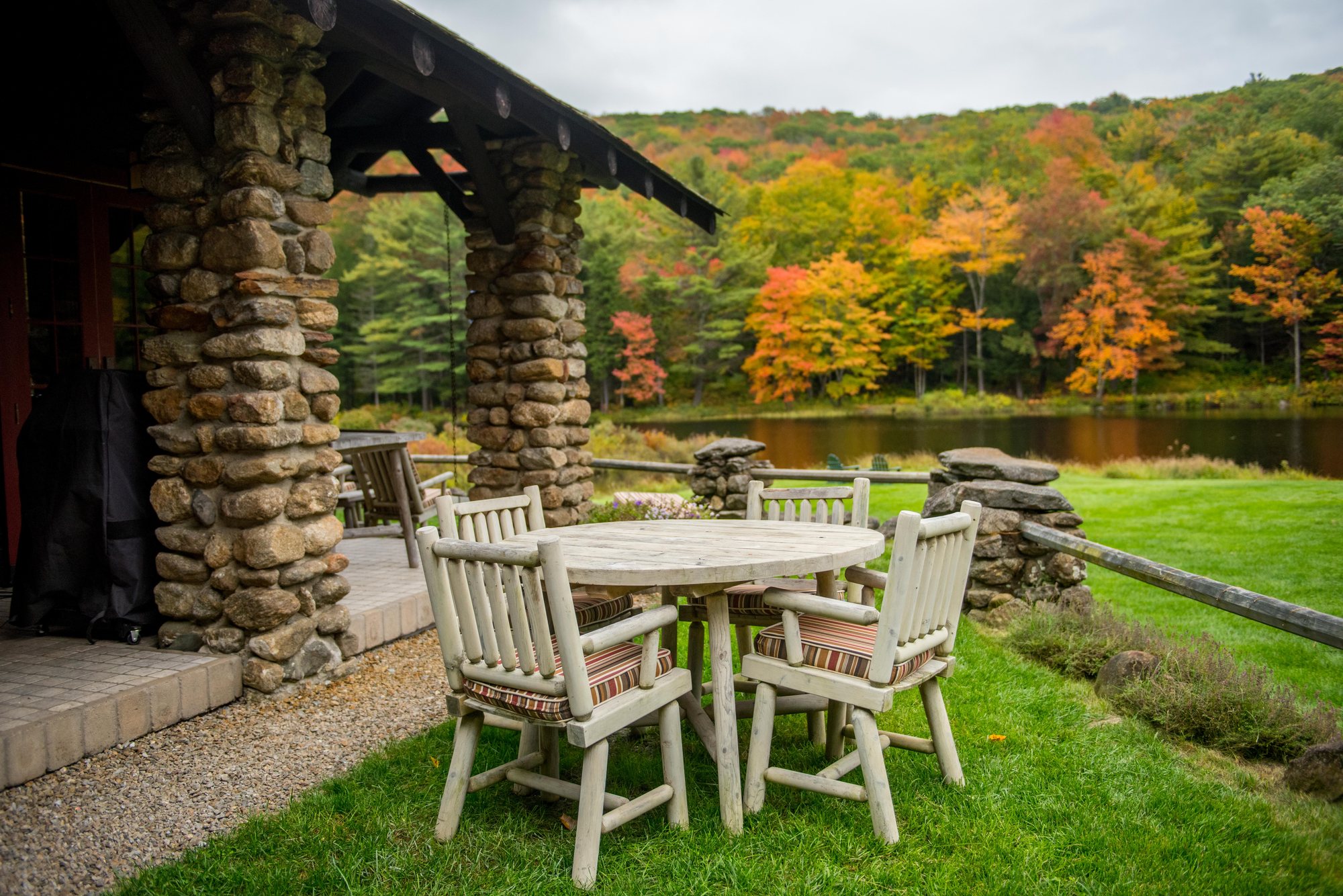 The Lodge porch with its stone columns, tables set out in October