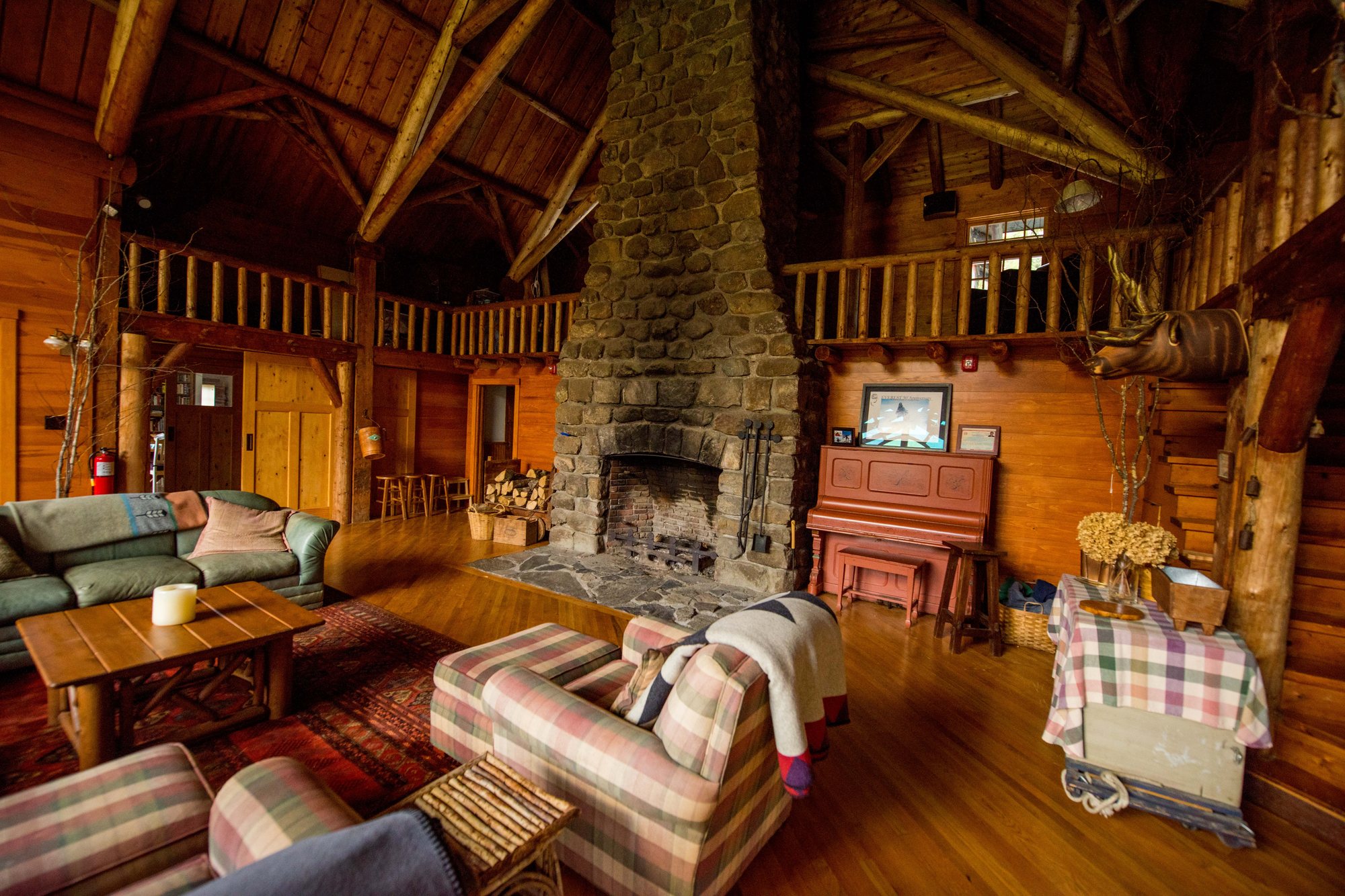 The Lodge Great Room, the stone fireplace and the timber roof