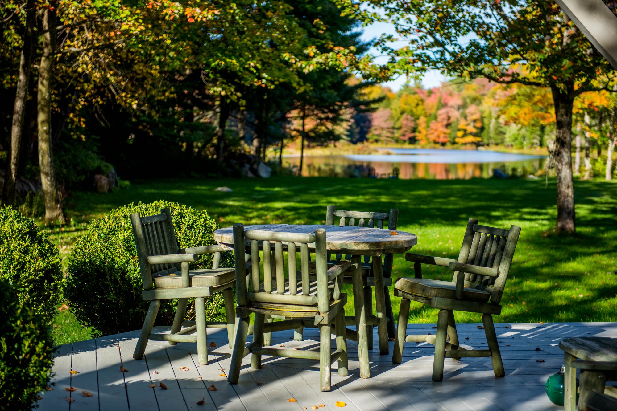 Morning on the Lodge deck, chairs set out above Woods Mill Pond