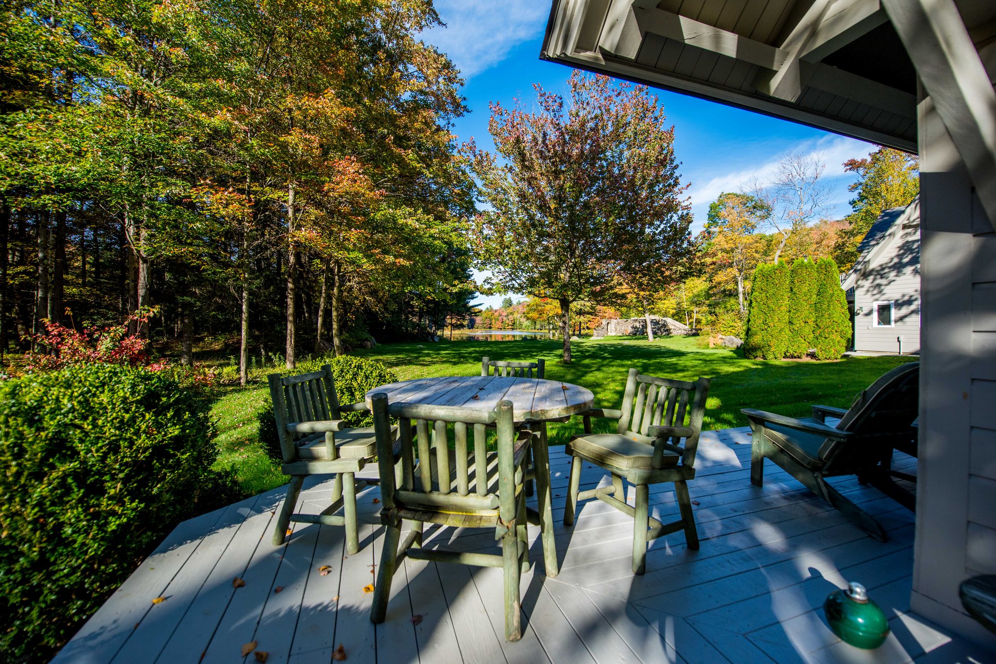 Tables on the Lodge deck and the lawn beyond