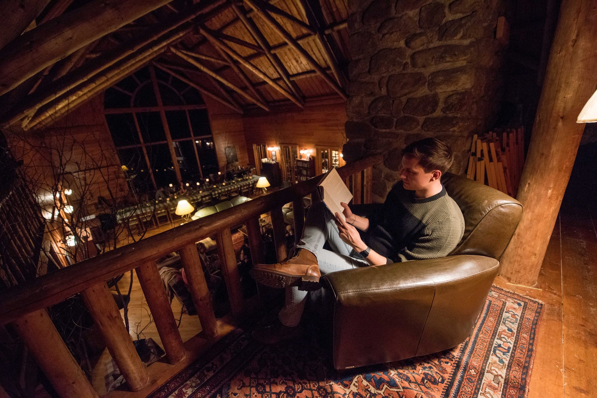 Reading on the Great Room sofas at night