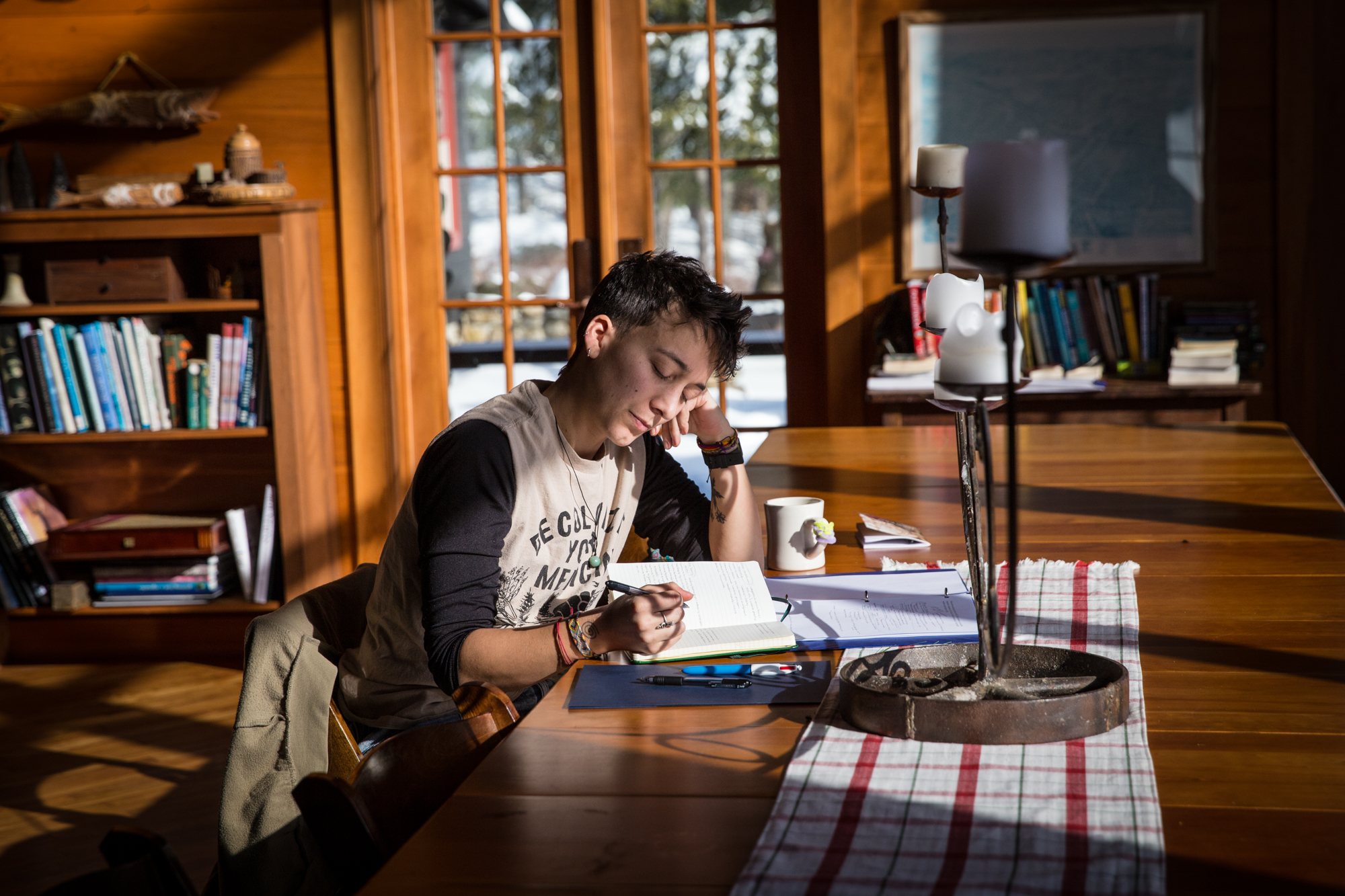 Working at a table by the Lodge windows