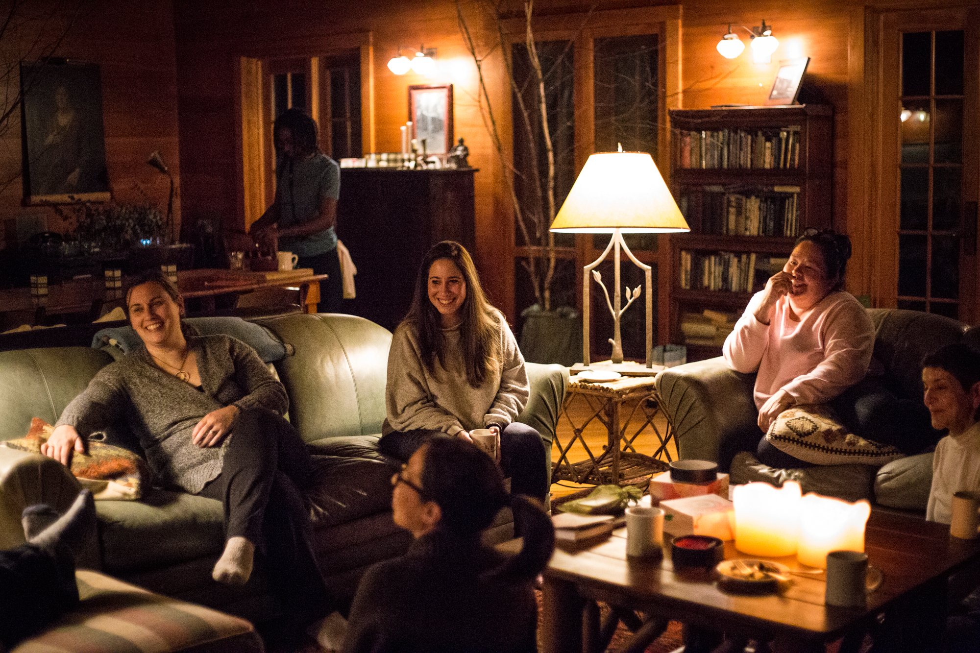 Talking in the Lodge sitting room by lamplight